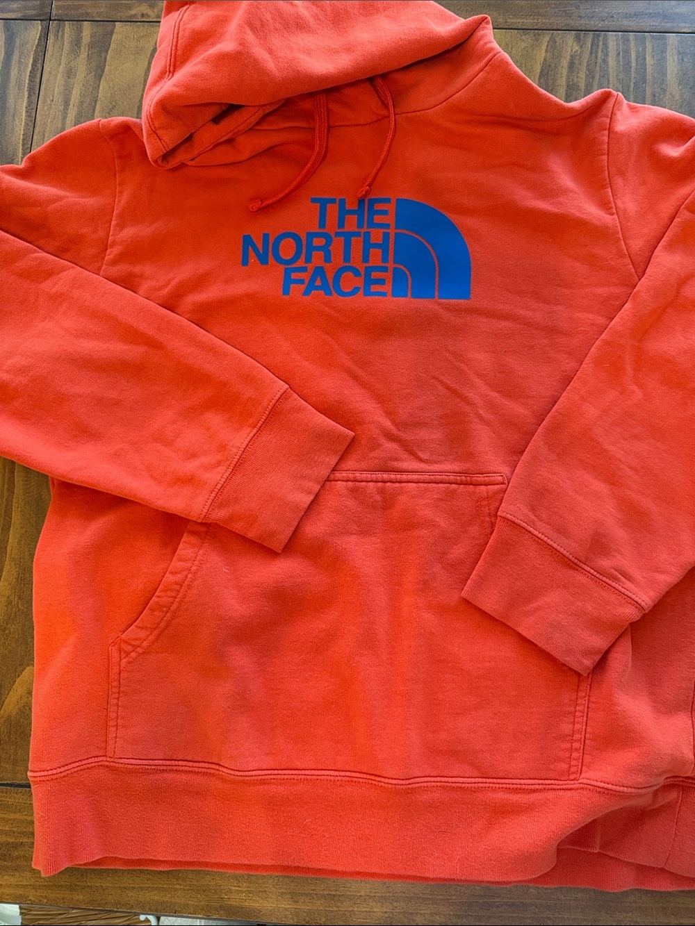 The North Face Men’s XL Orange Pullover Hoodie with Blue Logo
